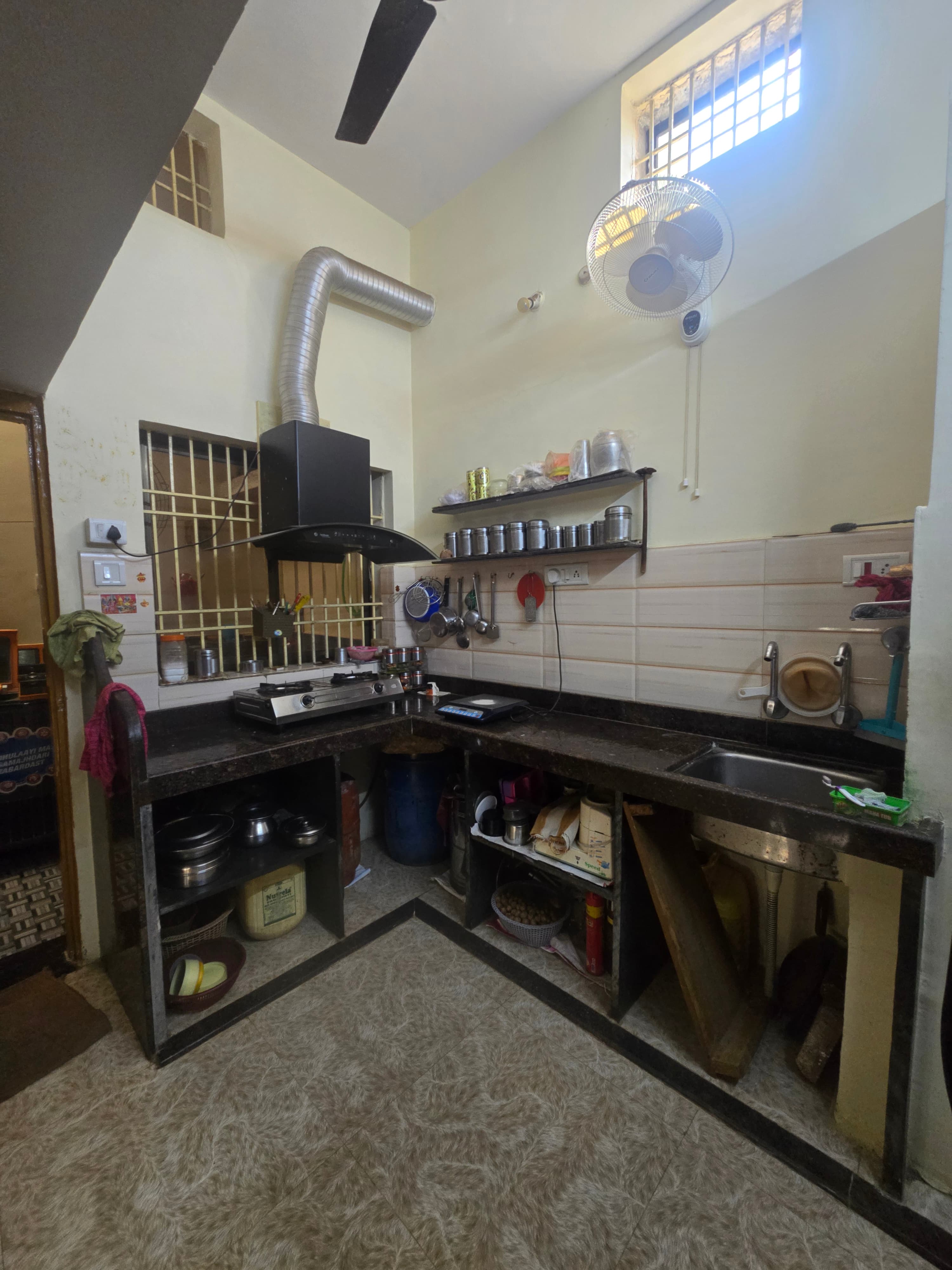 Kitchen before Aman Furniture's modular kitchen installation